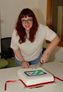 Michelle cuts the cake